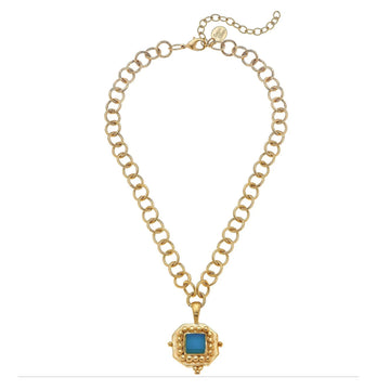 Charlotte pendant featuring an aqua French glass stone on a 24k gold-plated textured link chain with an extender.