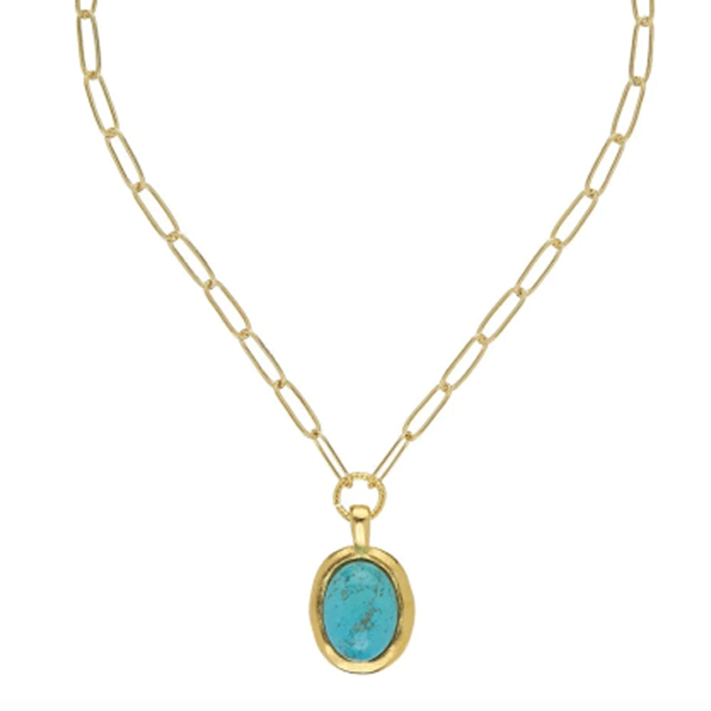 Oval turquoise cabochon pendant in a gold bezel setting on a gold paper clip chain necklace.