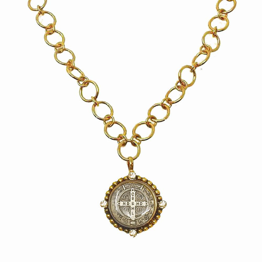 Gold chain necklace with ornate medal pendant featuring clear accents.
