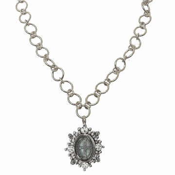 Silver chain necklace featuring a detailed circular pendant adorned with sparkling crystals.
