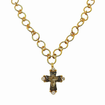 Gold chain necklace featuring a dark cross pendant accented with clear stones.
