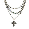 Metallic blue Bicone Magdalena necklace: layered crystal & cross pendant.
