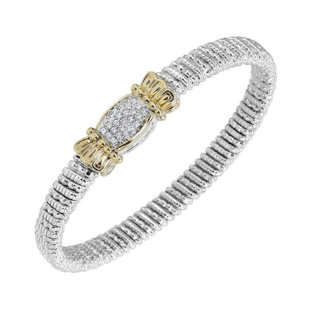 Elegant silver and gold bracelet featuring an oval pave diamond medallion.

