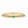 Gold cabochon bangle with green gemstones, textured band.
