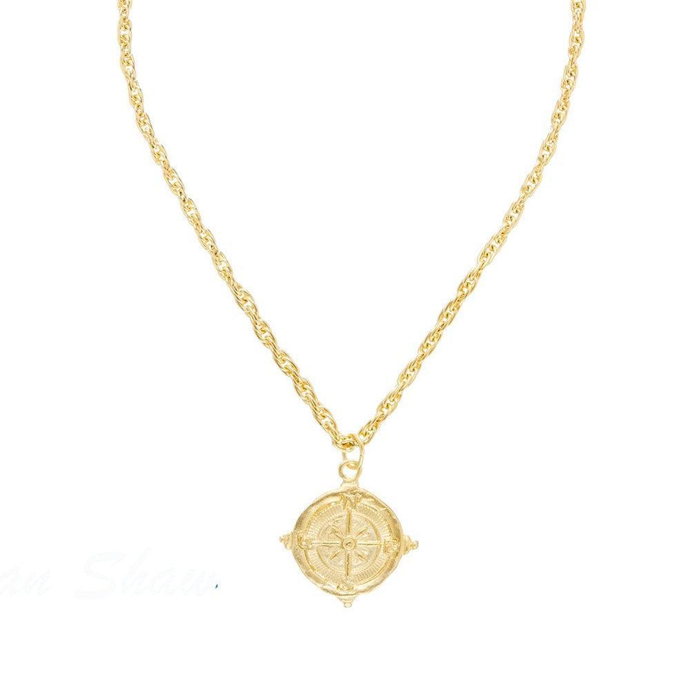 Gold Compass Rope Chain Pendant Necklace with intricate detailing.
