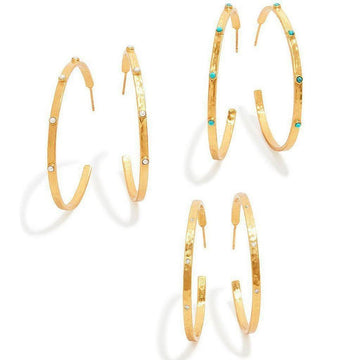 Gold hammered hoop earrings adorned with small gemstones.
