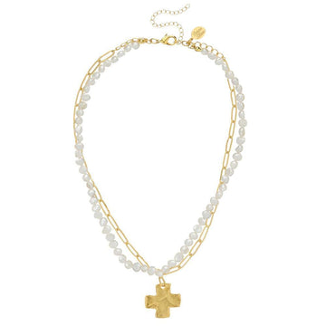 Gold chain and pearl double strand necklace with textured cross pendant.
