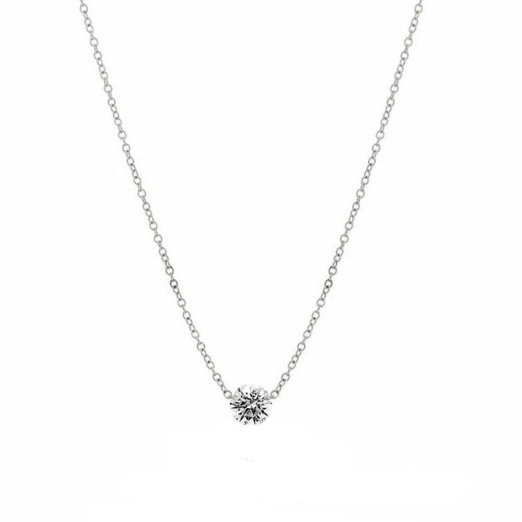 Elegant solitaire diamond pendant necklace with delicate chain.
