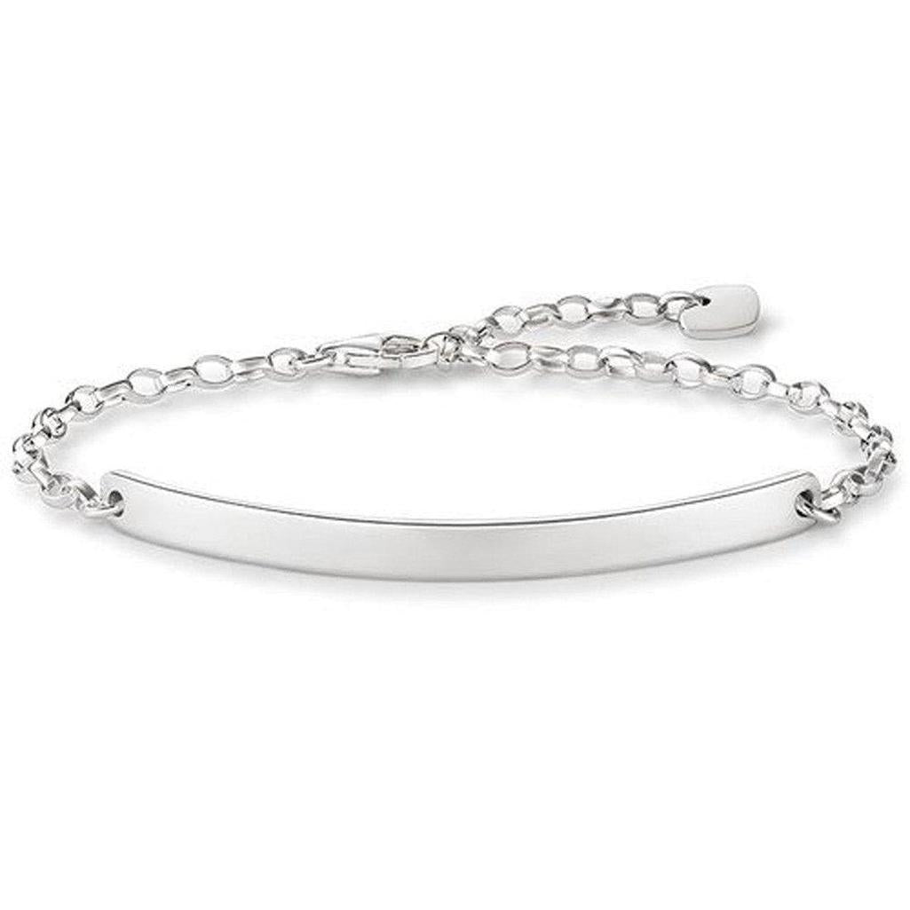 Engravable silver bracelet with chain and heart charm, personalized jewelry gift.
