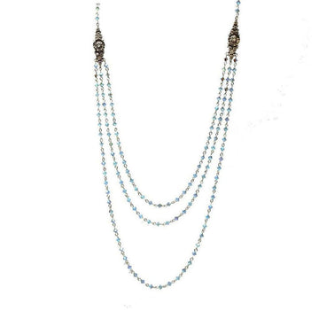 Layered light blue crystal beaded necklace with antique silver accents.
