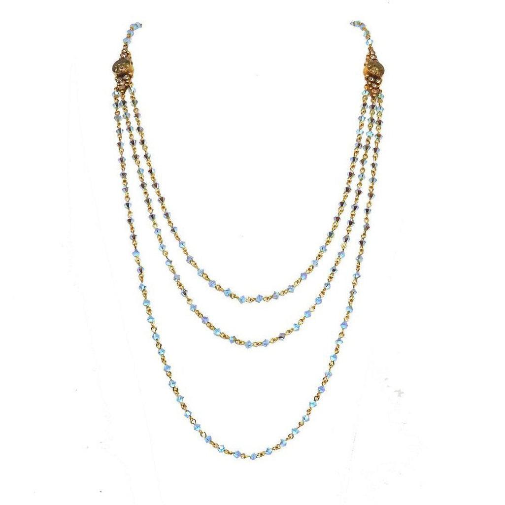 Fay Winged Bicone Magdalena necklace: Three-strand, light blue crystal and gold chain.
