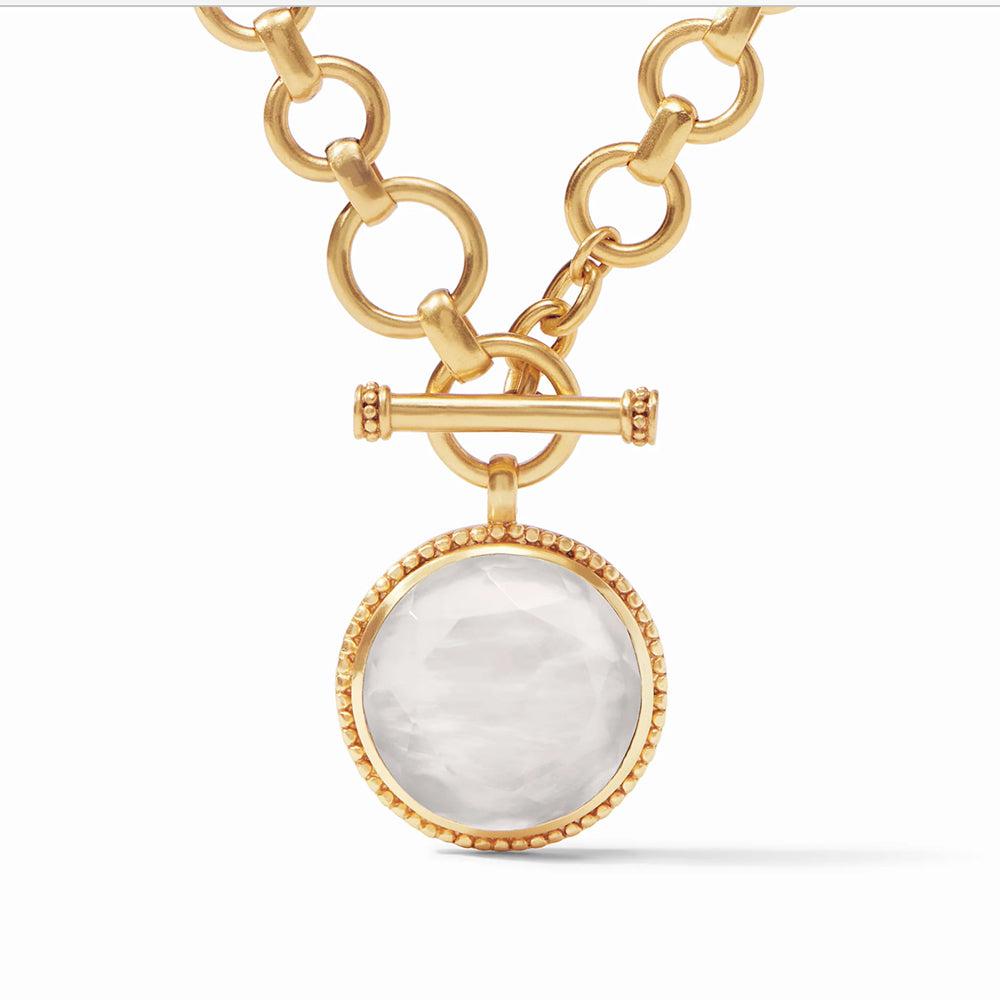 Gold Flora statement necklace with large white gemstone pendant
