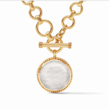 Gold Flora statement necklace with large white gemstone pendant
