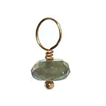 Green gemstone charm with gold wire and bead accents.
