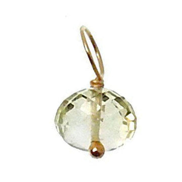Pale green gemstone pendant with gold accents on a white background
