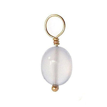 Oval gemstone pendant with gold wire accent.
