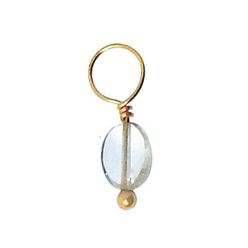 Clear quartz gemstone accent with gold wire and bead accents.
