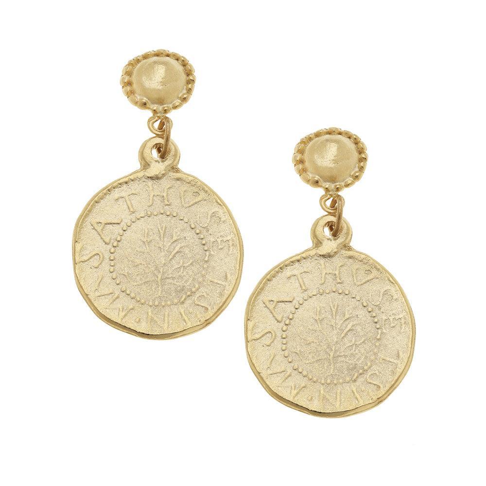 Gold coin dangle earrings with embossed tree design and ancient script.
