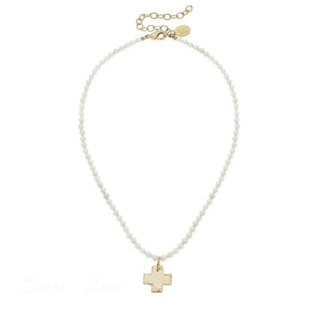 Delicate pearl necklace with gold cross pendant

