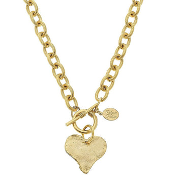 Hand-cast gold heart toggle necklace with textured heart charm and chunky chain.
