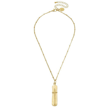 Gold cross pendant necklace on delicate chain.
