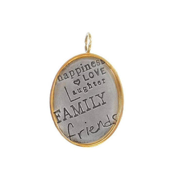 Silver charm with gold frame, inscribed "Happiness Love Laughter Family Friends."
