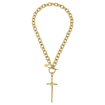 Gold cross pendant necklace with textured toggle clasp and chain.
