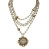 Lux Magdalena Labradorite necklace: layered grey gemstone beads, gold accents, & antique-style pendant.
