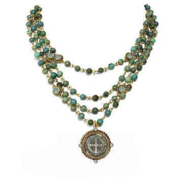 Turquoise and gold beaded necklace, layered design with a medal pendant.
