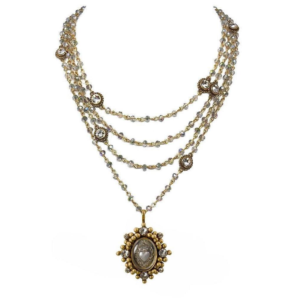 Multi-strand necklace featuring iridescent beads, gold accents, and a detailed pendant.

