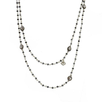 Double-strand necklace with dark gray crystals and silver accents.
