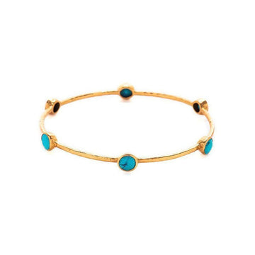 Gold bangle bracelet adorned with six turquoise stones.
