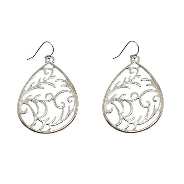 Silver teardrop earrings with ornate scrollwork design.
