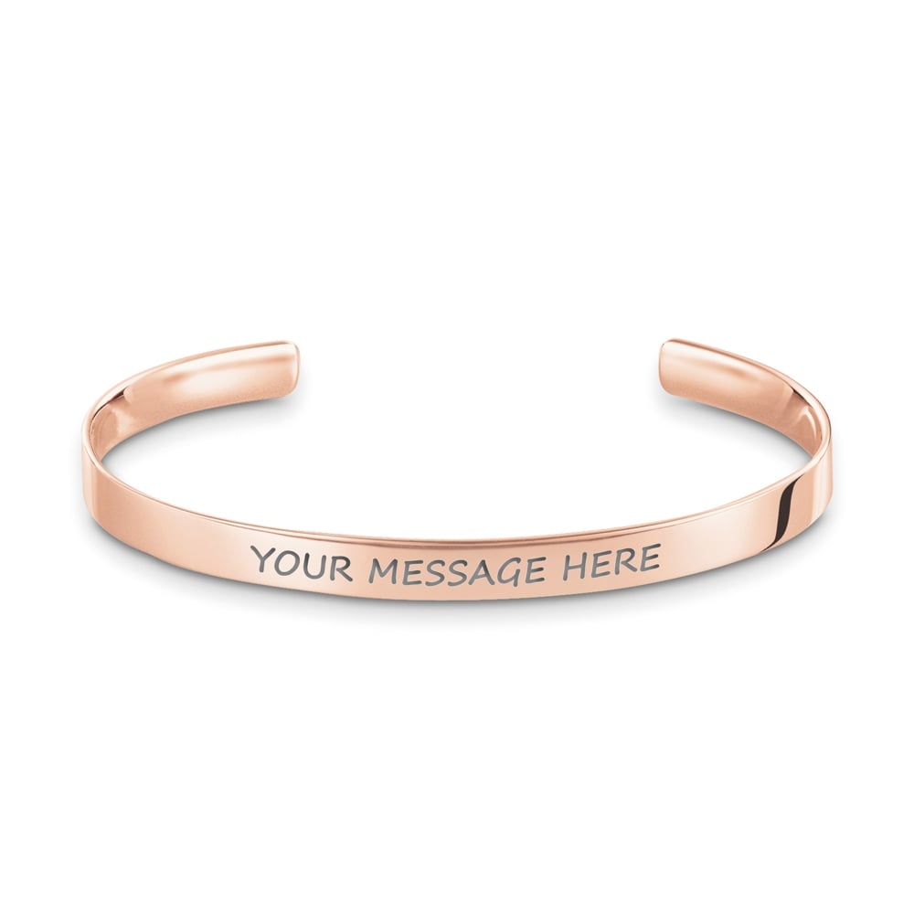 Rose gold cuff bracelet with customizable engraved message.
