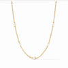 Marbella Pearl Station Necklace: Elegant gold chain with five lustrous pearls.
